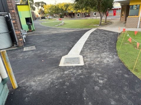 Asphalt path reinstatement at school grounds with utility box